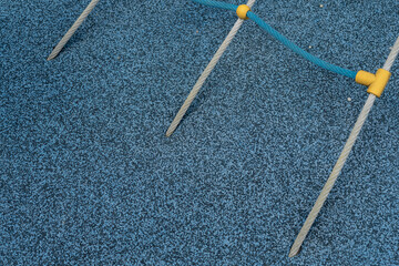 Plastic yellow rope clutch on the playground.
