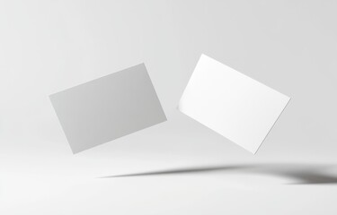 Two Blank Business Cards Floating in the Air on a White Background, Mockup Style