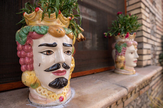 Taormina, Italy - June 19, 2024: Traditional Sicilian moorish heads decorating the house.