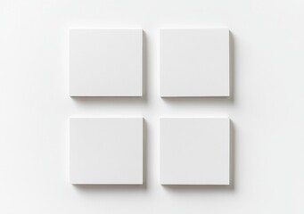 op View of Four Blank Business Cards on a White Background with Soft Shadows, Ideal for Showcasing Designs or Branding Concepts.