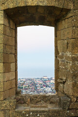 Obraz premium View over old city of Derbent and Caspian Sea from the window of fortress of Naryn-Kala. Derbent, Dagestan, Russia
