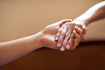 Elderly, hope or people with helping hands for assistance, support or comfort for care, trust or worship. Closeup, faith or mourning of widow for kindness, grief or peace for healing loss in home