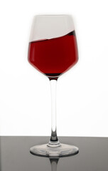 Red wine swirling into glass