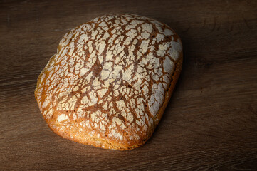 Fresh baked homemade sliced rye bread, top view, copy space