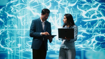 Teamworking colleagues using AI neural networks modeled after human brain to solve complex...