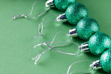 Shiny Christmas Balls on Green Background, New Year s Eve Celebration