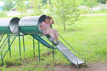 girl on slider outdoor backyard