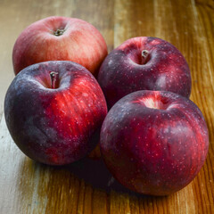Empire apples on a wooden surface