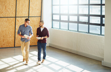 Business people, discussion and empty office with tablet and view for negotiation or lease on...
