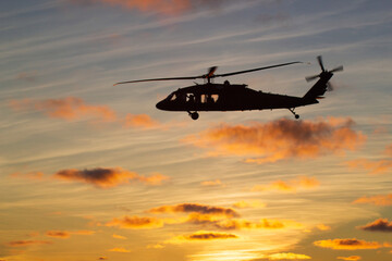 Sunset Soar: Helicopter Silhouette