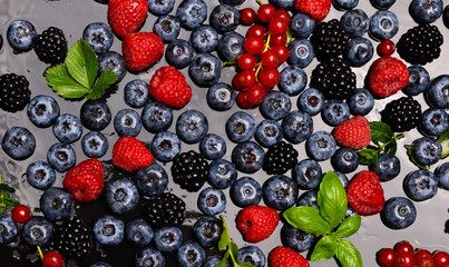 Berries. Summer berry fruit. Healthy lifestyle. Top view of fresh berries. Berries mix. Mixed berries background.