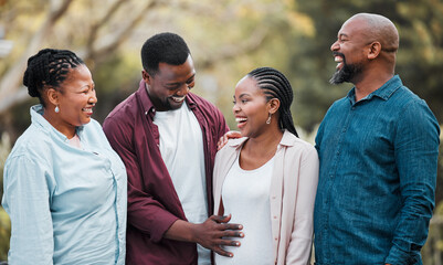 Woman, pregnancy and happy with black family in nature for security, care and love of future child. Smile, grandparents and man with hand on pregnant belly for maternity, parenthood and support