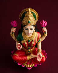 Fototapeta premium Closeup of Hindu goddess Lakshmi statue. Hinduism religion and Indian culture. Hindu goddess of wealth, good fortune, youth, and beauty