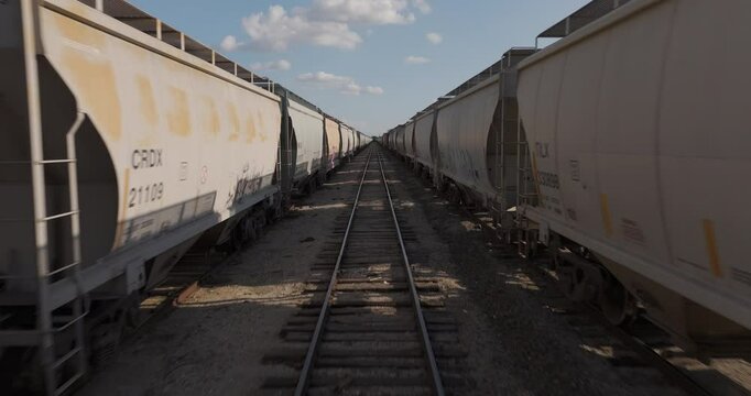 Freight train cars in kansas yard inside in between low
