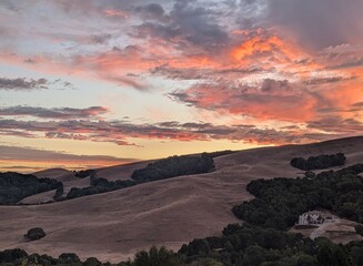 golden glow over rolling hills at sunset