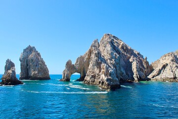 Scenic View Of  large rocks in the water with Arch of Cabo San Lucas in the background