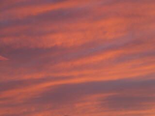 Tokyo, Japan - September 21, 2024: Beautiful clouds illuminated with the rising sun 
