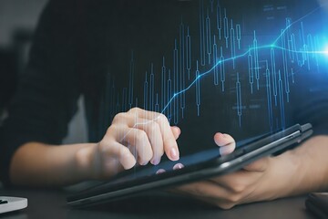 Person using a tablet with a digital graph overlay displaying fluctuating data lines.