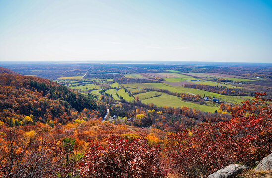 Panoramic picture postcard scenery from the highest point on the King mountain,Eardley escarpment with a view of Autumn fall colours in red,orange and yellow at Gatineau Park,Quebec,Canada