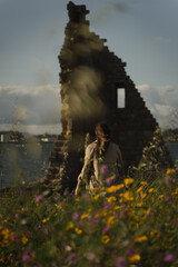 Woman walking towards San Sadurniño tower