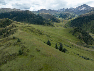 Fototapeta premium Beautiful forest mountains and grassland valley landscape in Sichuan,China