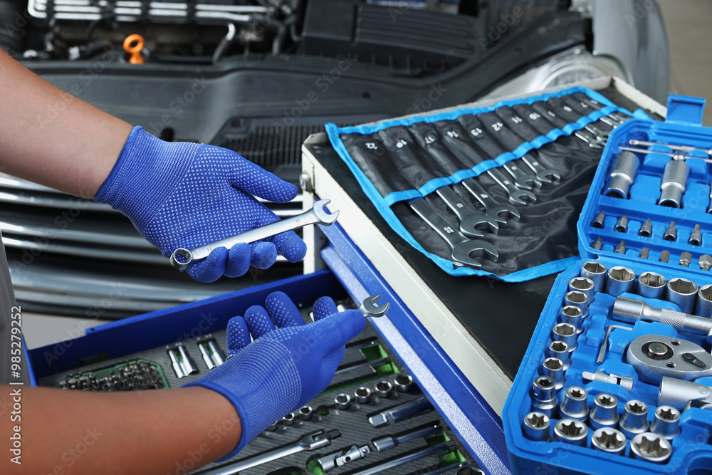 Canvas Prints Auto mechanic with different tools at automobile repair shop, closeup