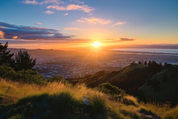 Panoramic view of Christchurch, New Zealand at sunrise with snow-capped mountains in background. Cityscape with buildings and roads in foreground. Sky with warm colors of sunrise.