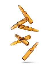 Many glass ampoules falling on white background