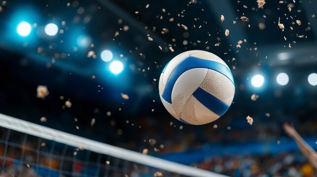 A volleyball soaring above the net in a dynamic sports environment.