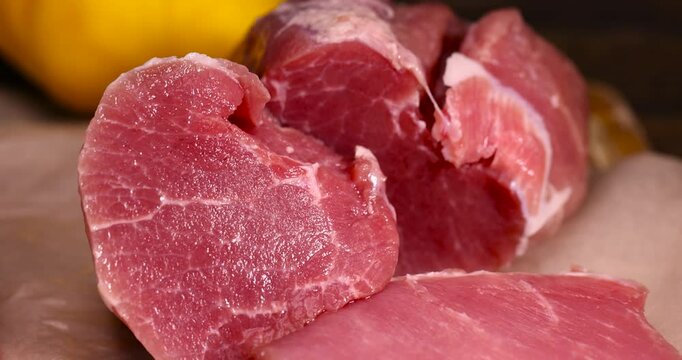 piece of pork fillet on a cutting board, sliced high-quality pork meat without bones