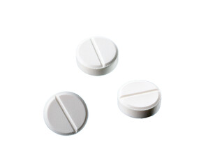 The image shows three white pills, which are commonly used as over-the-counter medication.