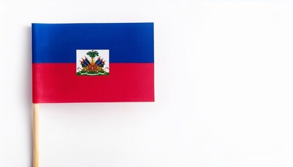 Fototapeta premium 小さな紙のハイチ共和国の国旗（small paper Haiti flag） 