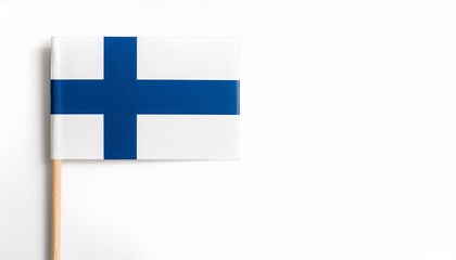 Obraz premium 小さな紙のフィンランド共和国の国旗（small paper Finland flag） 