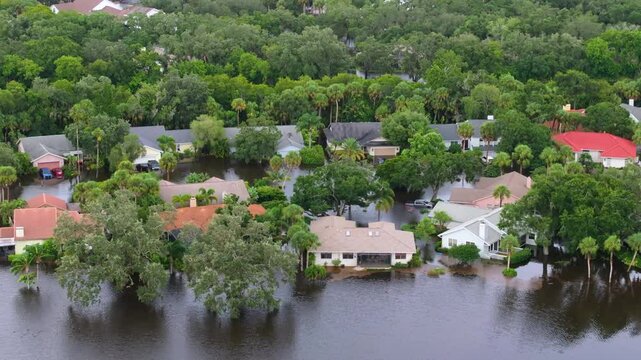 Flooded residential area with underwater houses from hurricane rainfall water in Florida suburban community. Aftermath of natural disaster in southern USA.