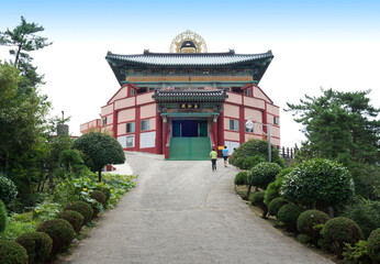 Goseong-gun, Gyeongsangnam-do, South Korea - January 1, 2015: Bhaisajyaguru Buddha Statue and the entrance of Bohyeonsa Temple at Muisan Mountain