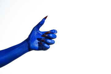 A witch's blue hand with sharp red nails on a white background. It exudes a demonic, monstrous vibe, blending vampire, alien, and ghostly features, creating a perfect Halloween horror image.