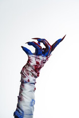 A blue witch hand with red nails, wrapped in a blood-stained bandage against a white background. This eerie, monstrous image evokes demonic, zombie, and ghostly vibes, perfect for Halloween horror.