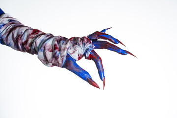 A blue witch hand with red nails, wrapped in a blood-stained bandage against a white background. This eerie, monstrous image evokes demonic, zombie, and ghostly vibes, perfect for Halloween horror.