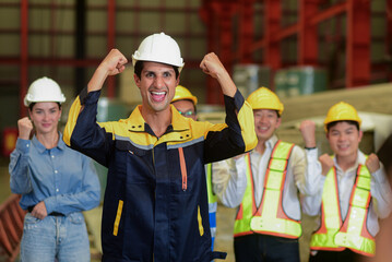 Close-up of a confident, leadership worker Latin man  wearing safety uniform workwear in front of him colleagues during a morning talk, meeting before work begins.teamwork and Achieve goals concept