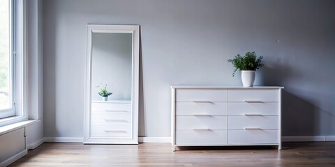 Bright bedroom with a full-length mirror and white dresser.