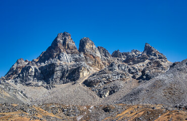 Scenic Rocky Mountain Trail under a Clear Blue Sky.