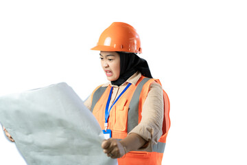 Young Asian female construction worker in hijab who looks confused when looking at the contents of a scroll of blueprints, industrial and construction concepts, isolated white background.