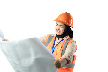 Young Asian female construction worker in hijab who looks confused when looking at the contents of a scroll of blueprints, industrial and construction concepts, isolated white background.