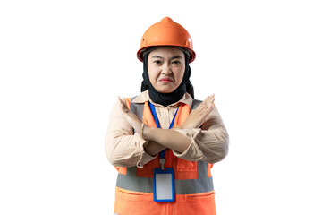 Young Asian female construction worker wearing hijab making a gesture of rejection while looking at the camera, gesture of rejection, industrial and construction concept, isolated white background.