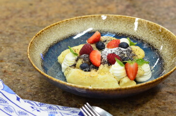 A beautifully plated serving of traditional Czech potato dumplings, known as 