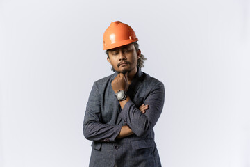 optimistic mens expressions and gestures thinking. stylish asian man with suit and orange helmet on white background. construction or mining business concept photo