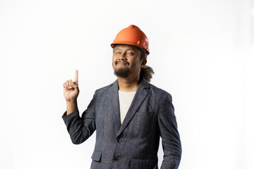 the project leader looks happy and holds up a finger. stylish asian man with orange suit and helmet on white background. construction or mining business concept photo