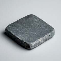 grey stone on a grey background, the stone is flat to place the packaging on it