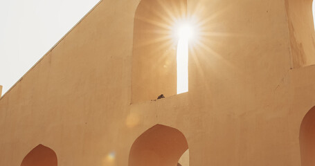 Jaipur, Rajasthan, India. Sun shining through instrument in old astronomical observation. Jantar Mantar, in Jaipur, is an astronomical observation site built in the early 18th century. It includes a