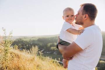 Father and Toddler Enjoying Beautiful Outdoor Moment on a Sunny Day